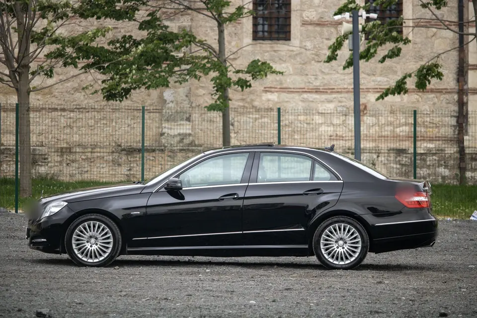 Sleek Black Sedan Car Parked Outdoors
