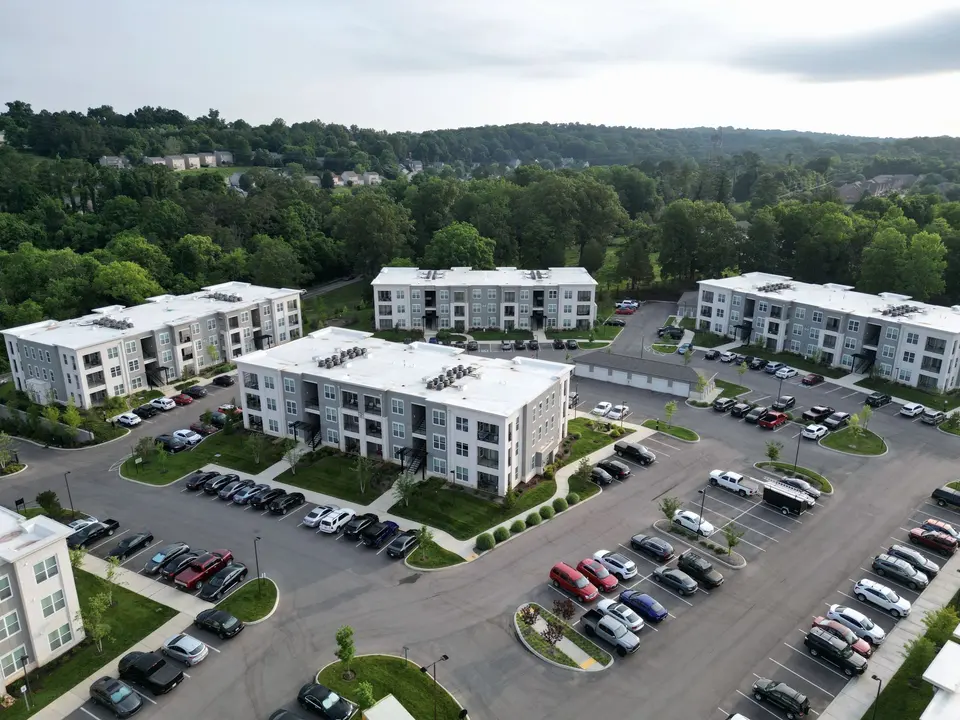 Cars on a Parking Lot of a Condominium Buildings